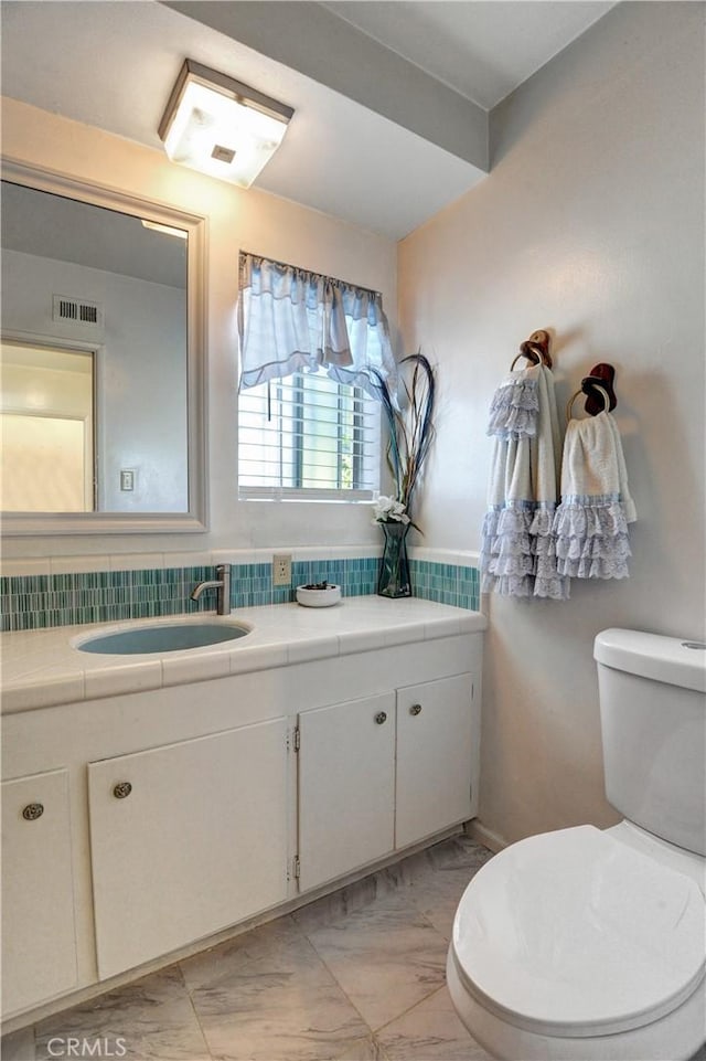12108 Muriel Dr, Lynwood, CA 90262 - half bath with vanity and marble finish floors