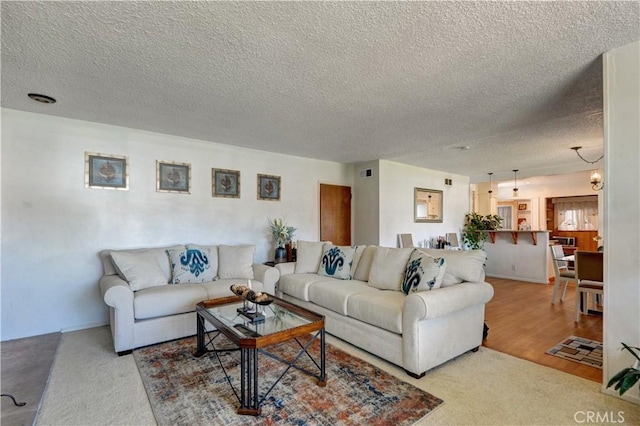 12108 Muriel Dr, Lynwood, CA 90262 - living area with a textured ceiling and carpet floors
