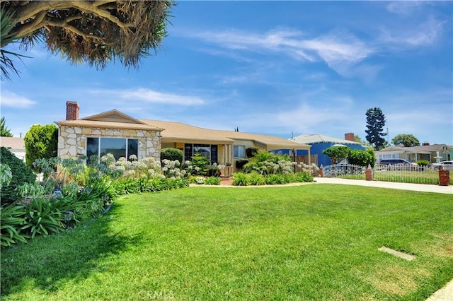 12108 Muriel Dr, Lynwood, CA 90262 - view of front of home with a chimney and stone siding
