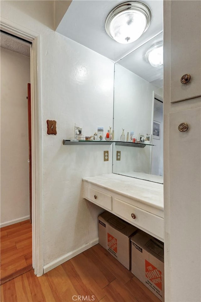 12108 Muriel Dr, Lynwood, CA 90262 - bathroom featuring wood finished floors and baseboards