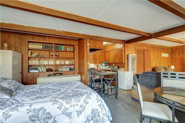 12108 Muriel Dr, Lynwood, CA 90262 - bedroom with wooden walls, beamed ceiling, and carpet