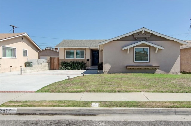 12517 Walcroft St, Lakewood, CA 90715 - view of front of home featuring stucco siding and driveway