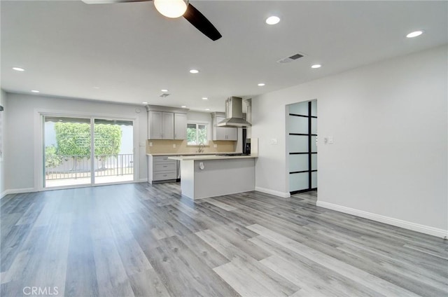 12517 Walcroft St, Lakewood, CA 90715 - unfurnished living room with a ceiling fan, light wood-style flooring, and recessed lighting