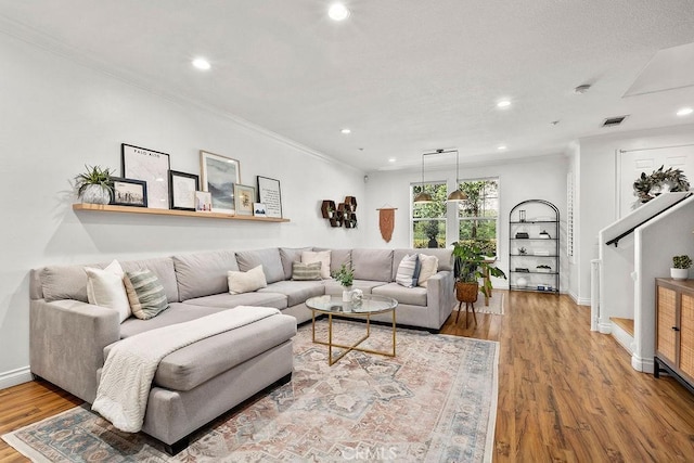 5 Duxbury St, Ladera Ranch, CA 92694 - living area with wood finished floors, ornamental molding, and recessed lighting