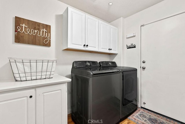 5 Duxbury St, Ladera Ranch, CA 92694 - washroom featuring washing machine and clothes dryer, cabinet space, and wood finished floors