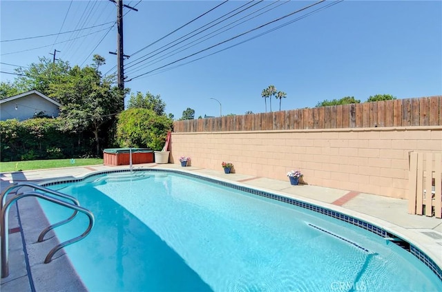 1251 Hackett Ave, Long Beach, CA 90815 - view of swimming pool with a hot tub, a fenced backyard, and a patio