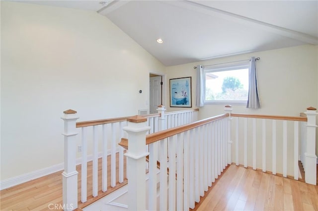 1251 Hackett Ave, Long Beach, CA 90815 - hallway featuring lofted ceiling, light wood finished floors, and an upstairs landing