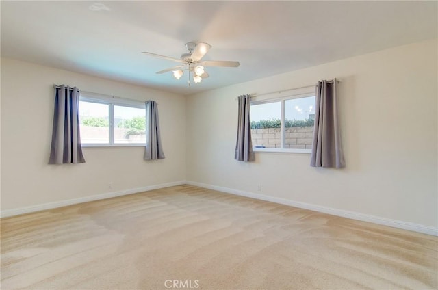 1251 Hackett Ave, Long Beach, CA 90815 - empty room featuring light carpet and a ceiling fan