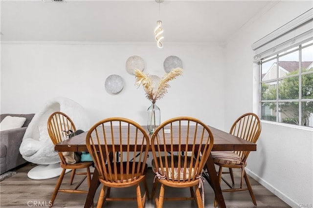 13750 Hubbard St Unit 77, Sylmar, CA 91342 - dining area with ornamental molding and wood finished floors