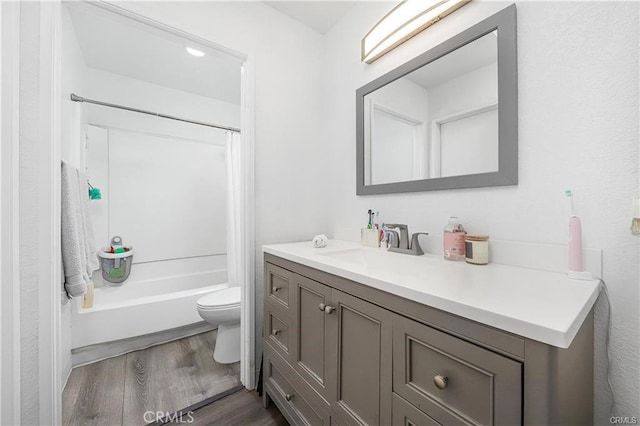 13750 Hubbard St Unit 77, Sylmar, CA 91342 - bathroom with vanity, wood finished floors, and shower / bath combo with shower curtain