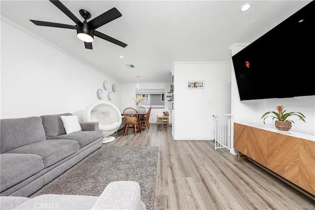 13750 Hubbard St Unit 77, Sylmar, CA 91342 - living room featuring crown molding, light wood-style floors, a ceiling fan, and recessed lighting