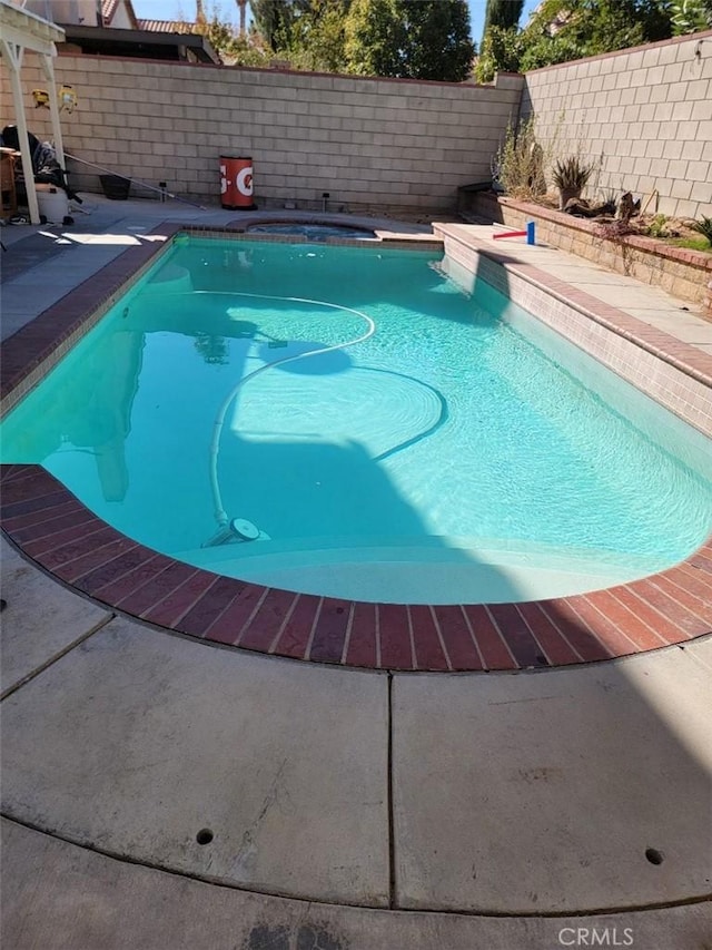 36901 33rd St E, Palmdale, CA 93550 - view of pool featuring a fenced backyard and a pool with connected hot tub
