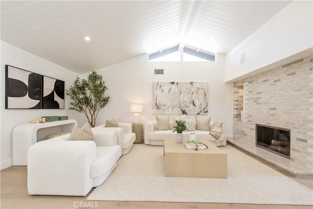 19281 Sierra Inez Rd, Irvine, CA 92603 - living area featuring a brick fireplace, vaulted ceiling, and wood finished floors