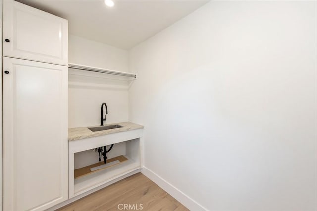 19281 Sierra Inez Rd, Irvine, CA 92603 - walk in closet with a sink and light wood finished floors