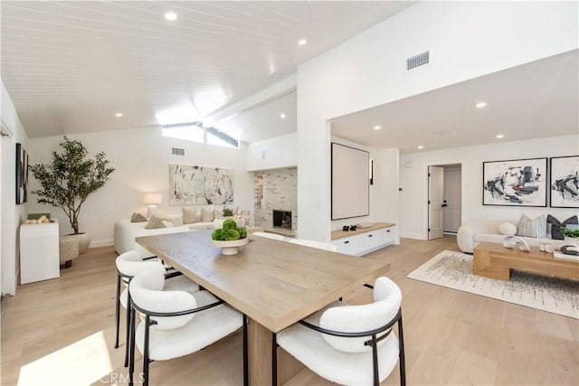 19281 Sierra Inez Rd, Irvine, CA 92603 - dining area with light wood-style floors, a fireplace, and recessed lighting