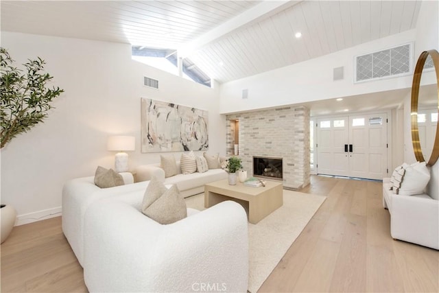 19281 Sierra Inez Rd, Irvine, CA 92603 - living room with light wood-style flooring, high vaulted ceiling, a fireplace, a wooden ceiling with exposed beams, and recessed lighting