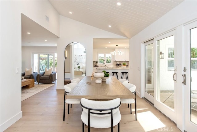 19281 Sierra Inez Rd, Irvine, CA 92603 - dining room with lofted ceiling, recessed lighting, a chandelier, light wood-type flooring, and healthy amount of natural light