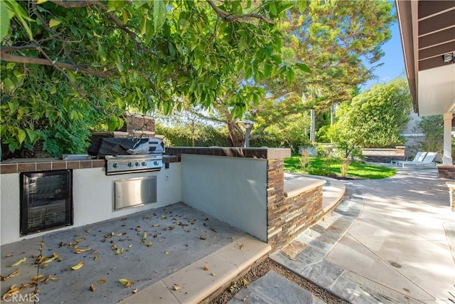 19281 Sierra Inez Rd, Irvine, CA 92603 - view of patio / terrace featuring beverage cooler and an outdoor kitchen