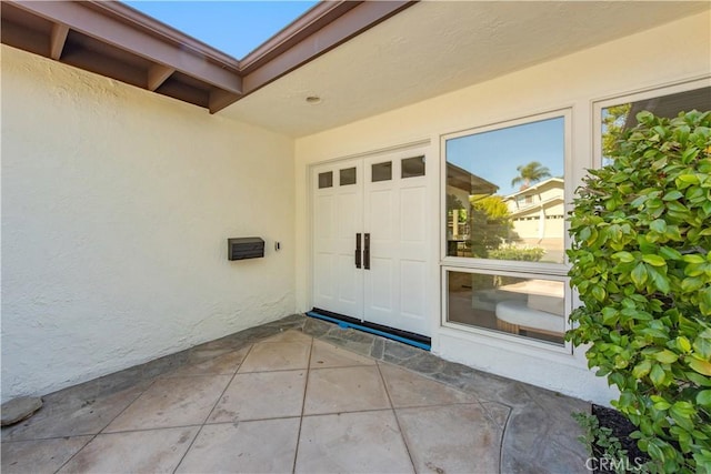19281 Sierra Inez Rd, Irvine, CA 92603 - entrance to property with stucco siding and a patio area