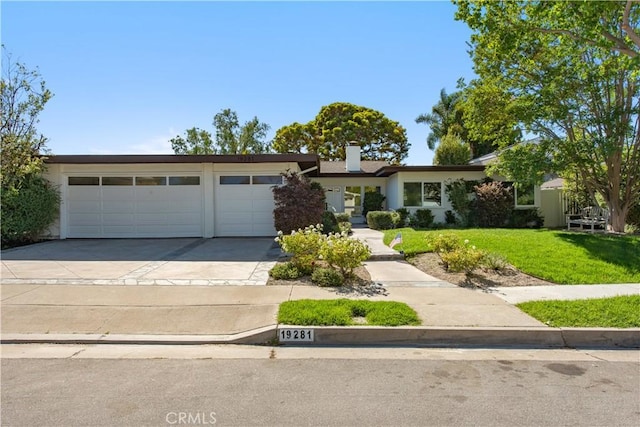 19281 Sierra Inez Rd, Irvine, CA 92603 - view of front facade featuring a garage, driveway, a front lawn, and a chimney