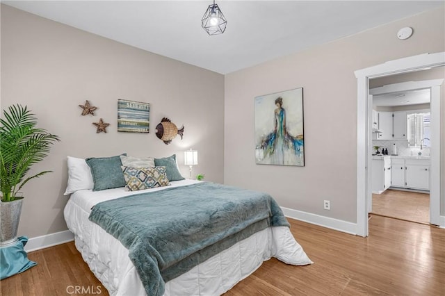 1269 W 1st St, San Pedro, CA 90732 - bedroom with light wood-type flooring and baseboards