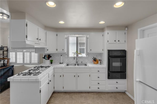 1269 W 1st St, San Pedro, CA 90732 - kitchen featuring white appliances, a warming drawer, tile countertops, white cabinets, and recessed lighting