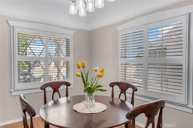 1269 W 1st St, San Pedro, CA 90732 - dining room with wood finished floors, a chandelier, and ornamental molding