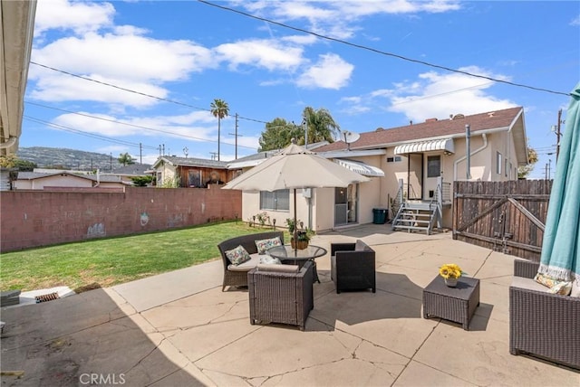 1269 W 1st St, San Pedro, CA 90732 - fenced backyard featuring an outdoor hangout area and a patio