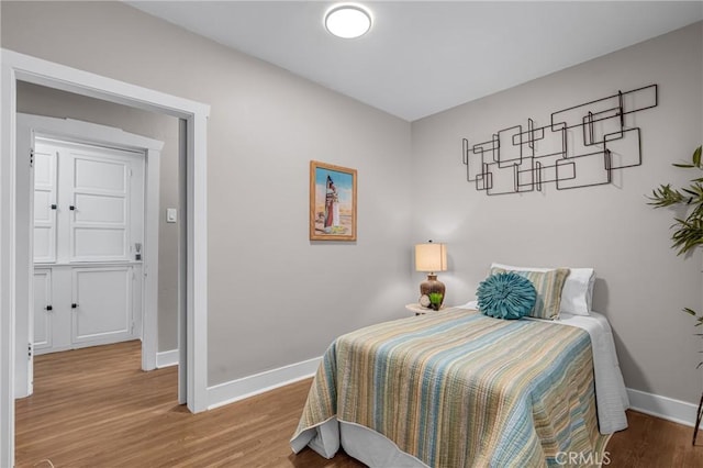 1269 W 1st St, San Pedro, CA 90732 - bedroom with baseboards and wood finished floors