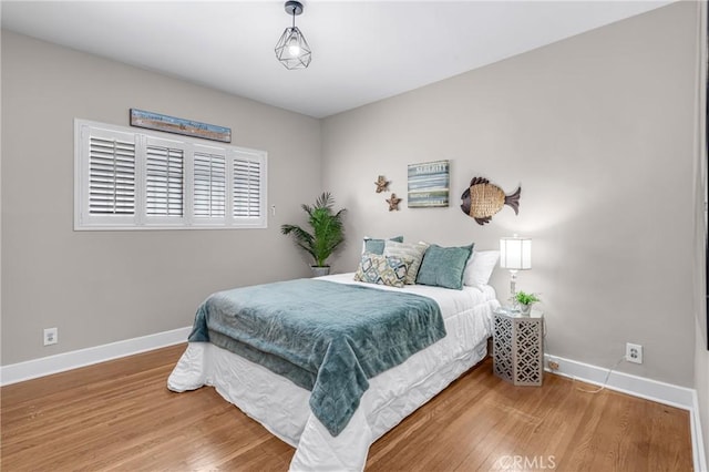 1269 W 1st St, San Pedro, CA 90732 - bedroom with baseboards and wood finished floors