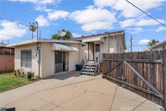 1269 W 1st St, San Pedro, CA 90732 - view of front of house featuring stucco siding and a patio area