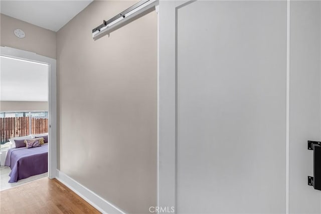 1269 W 1st St, San Pedro, CA 90732 - hall featuring wood finished floors and a barn door