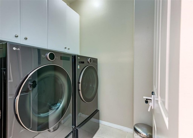 440 N Santa Maria St, Anaheim, CA 92801 - washroom featuring washer and clothes dryer, cabinet space, and light tile patterned flooring