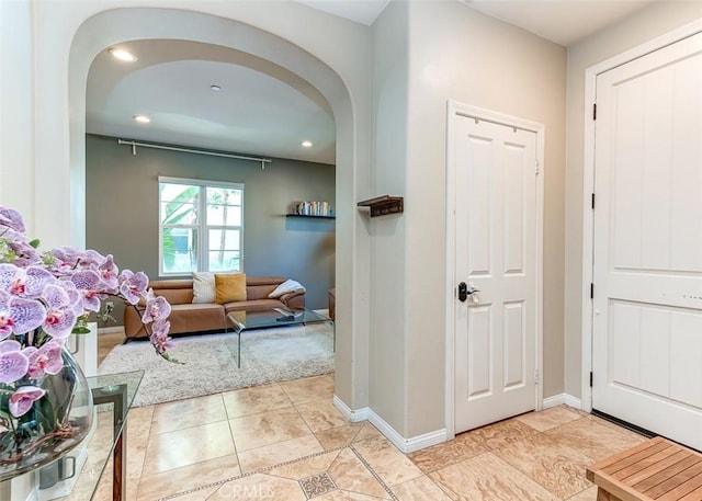 440 N Santa Maria St, Anaheim, CA 92801 - foyer entrance with arched walkways, light tile patterned floors, and recessed lighting