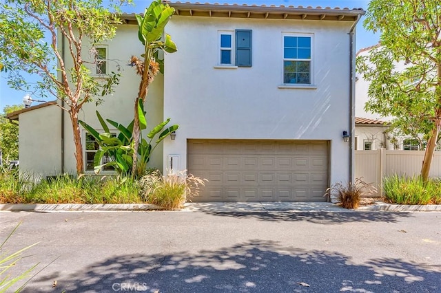 440 N Santa Maria St, Anaheim, CA 92801 - mediterranean / spanish-style home featuring stucco siding, a garage, and driveway