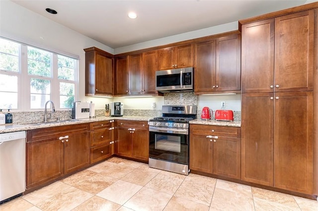 440 N Santa Maria St, Anaheim, CA 92801 - kitchen featuring appliances with stainless steel finishes, light stone counters, recessed lighting, and backsplash