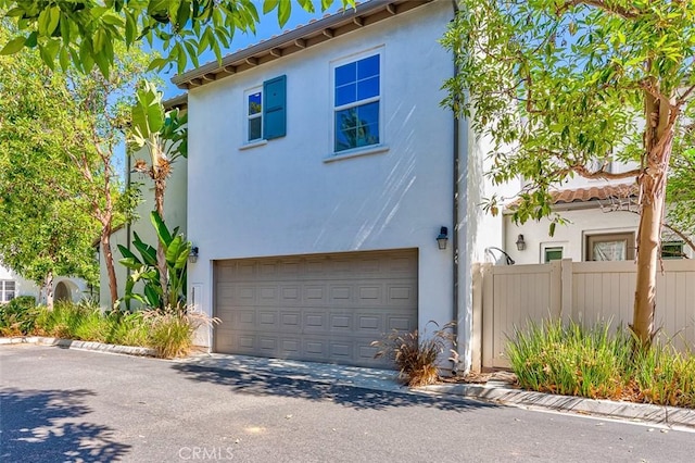 440 N Santa Maria St, Anaheim, CA 92801 - mediterranean / spanish-style house with driveway, an attached garage, and stucco siding