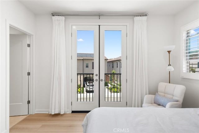 246 Canterbury, Irvine, CA 92618 - bedroom featuring access to outside, light wood-style flooring, and french doors