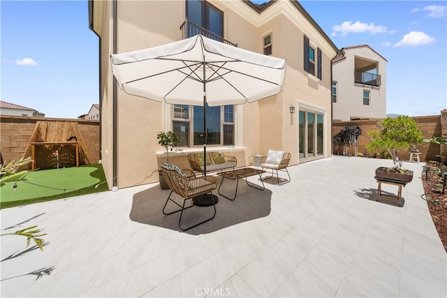 246 Canterbury, Irvine, CA 92618 - fenced backyard featuring a putting green and a patio