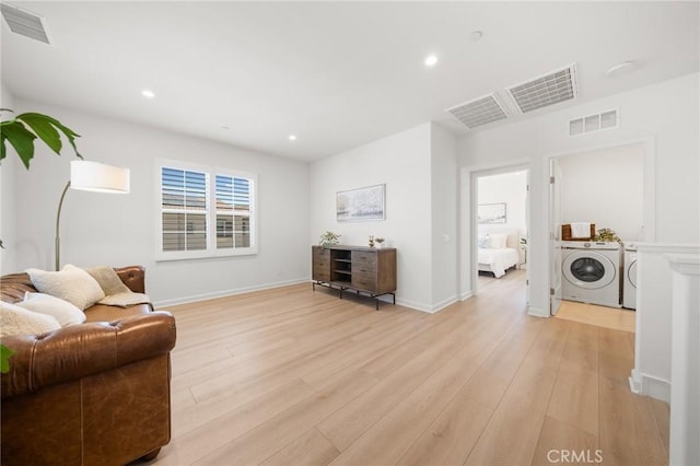 246 Canterbury, Irvine, CA 92618 - sitting room featuring washer and dryer, light wood finished floors, and recessed lighting