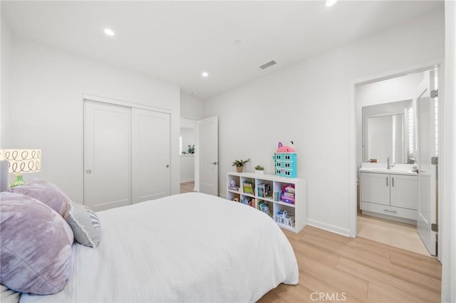 246 Canterbury, Irvine, CA 92618 - bedroom featuring light wood-style flooring, recessed lighting, a closet, and connected bathroom