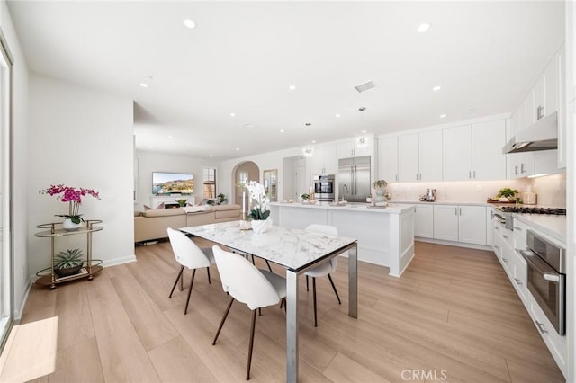 246 Canterbury, Irvine, CA 92618 - dining room with light wood-style flooring and recessed lighting