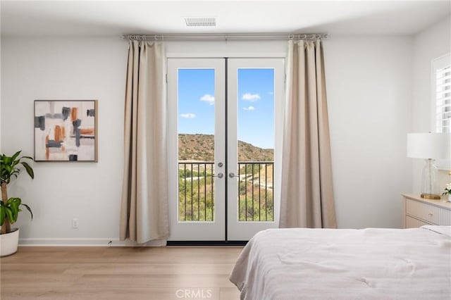 246 Canterbury, Irvine, CA 92618 - bedroom featuring french doors, access to outside, and light wood finished floors