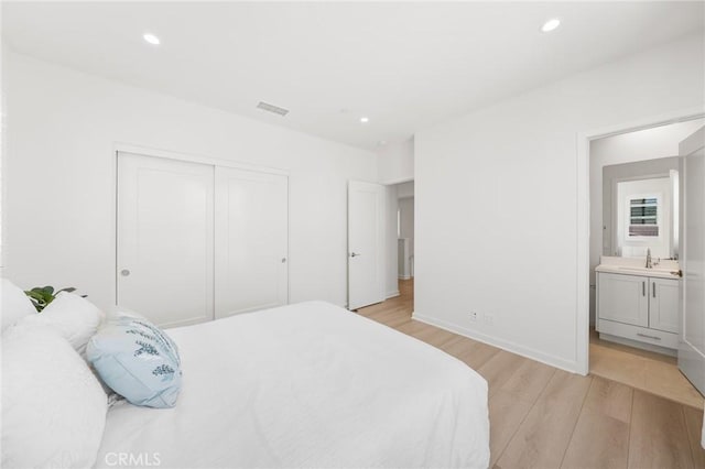 246 Canterbury, Irvine, CA 92618 - bedroom with light wood-style flooring, a closet, recessed lighting, and connected bathroom