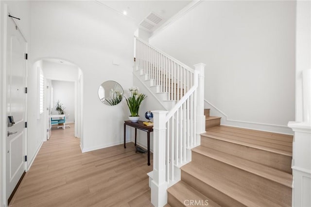 246 Canterbury, Irvine, CA 92618 - staircase with arched walkways and wood finished floors