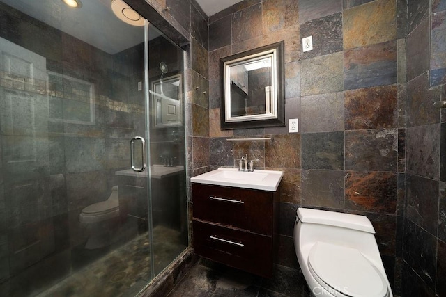11302 Cheddar St, Norwalk, CA 90650 - bathroom featuring tile walls, vanity, and a shower stall
