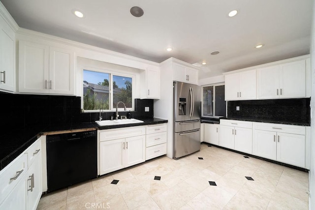 11302 Cheddar St, Norwalk, CA 90650 - kitchen with dishwasher, stainless steel fridge, dark countertops, white cabinets, and backsplash