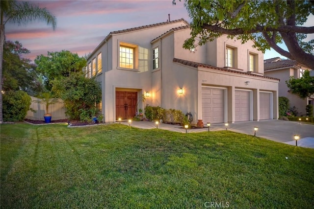 32197 Callesito Fadrique, Temecula, CA 92592 - mediterranean / spanish house featuring driveway, an attached garage, stucco siding, and a front yard