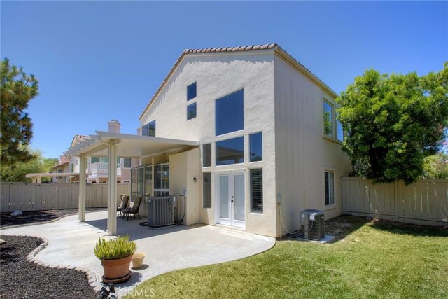 32197 Callesito Fadrique, Temecula, CA 92592 - rear view of house with french doors, stucco siding, a fenced backyard, and a patio area