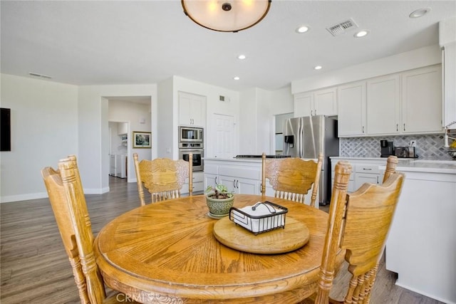 32197 Callesito Fadrique, Temecula, CA 92592 - dining area featuring washer and dryer, wood finished floors, and recessed lighting